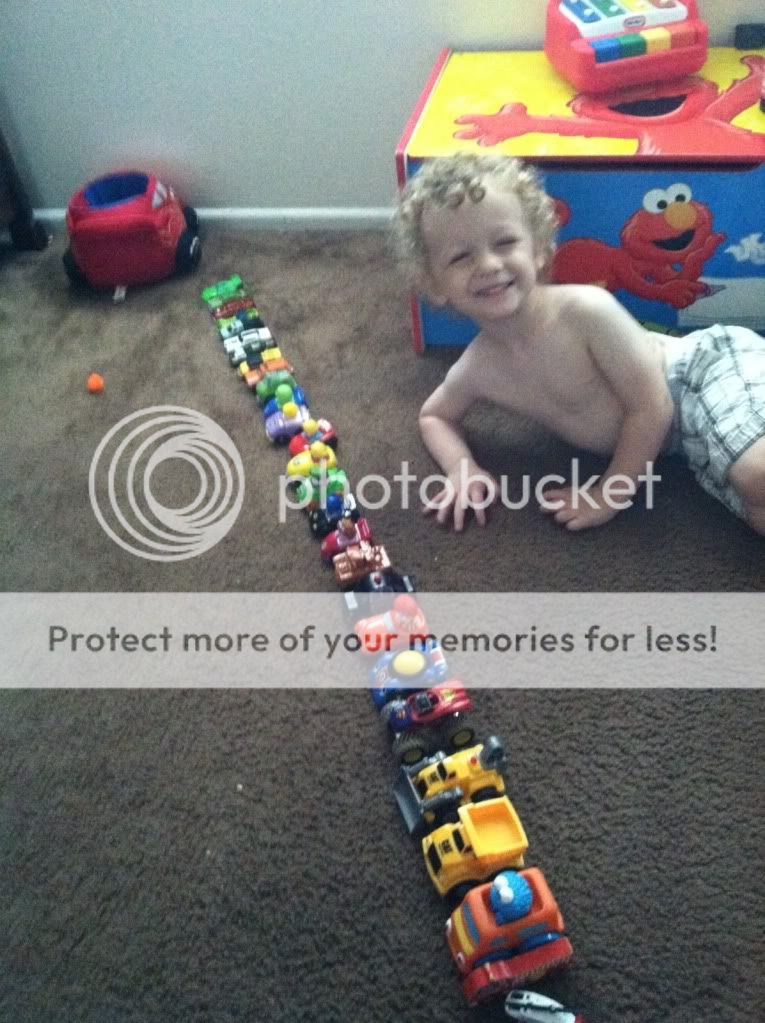 2 year old lining up toys